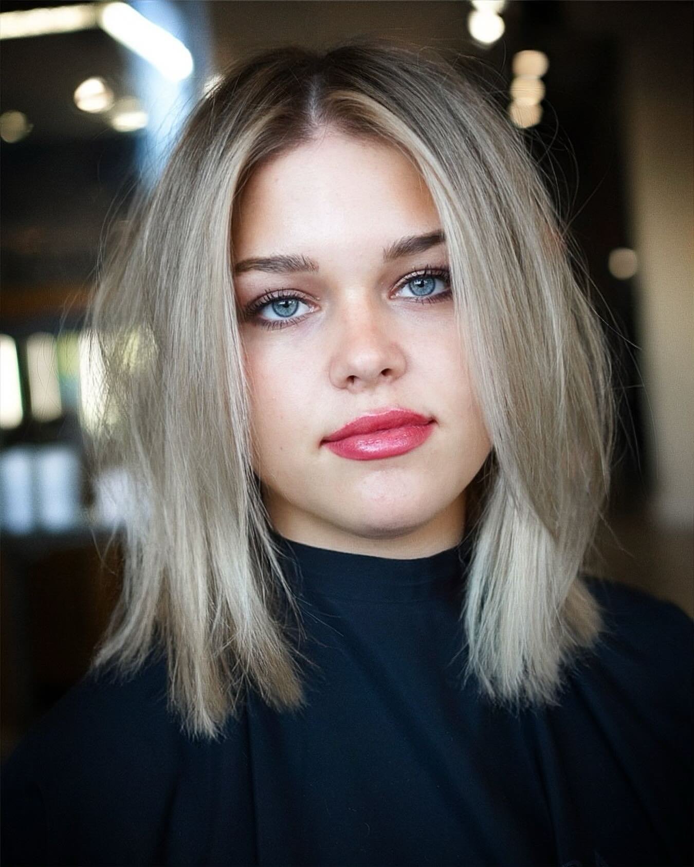 Mid Length Blonde Hair with Textured Ends and Soft Face Framing