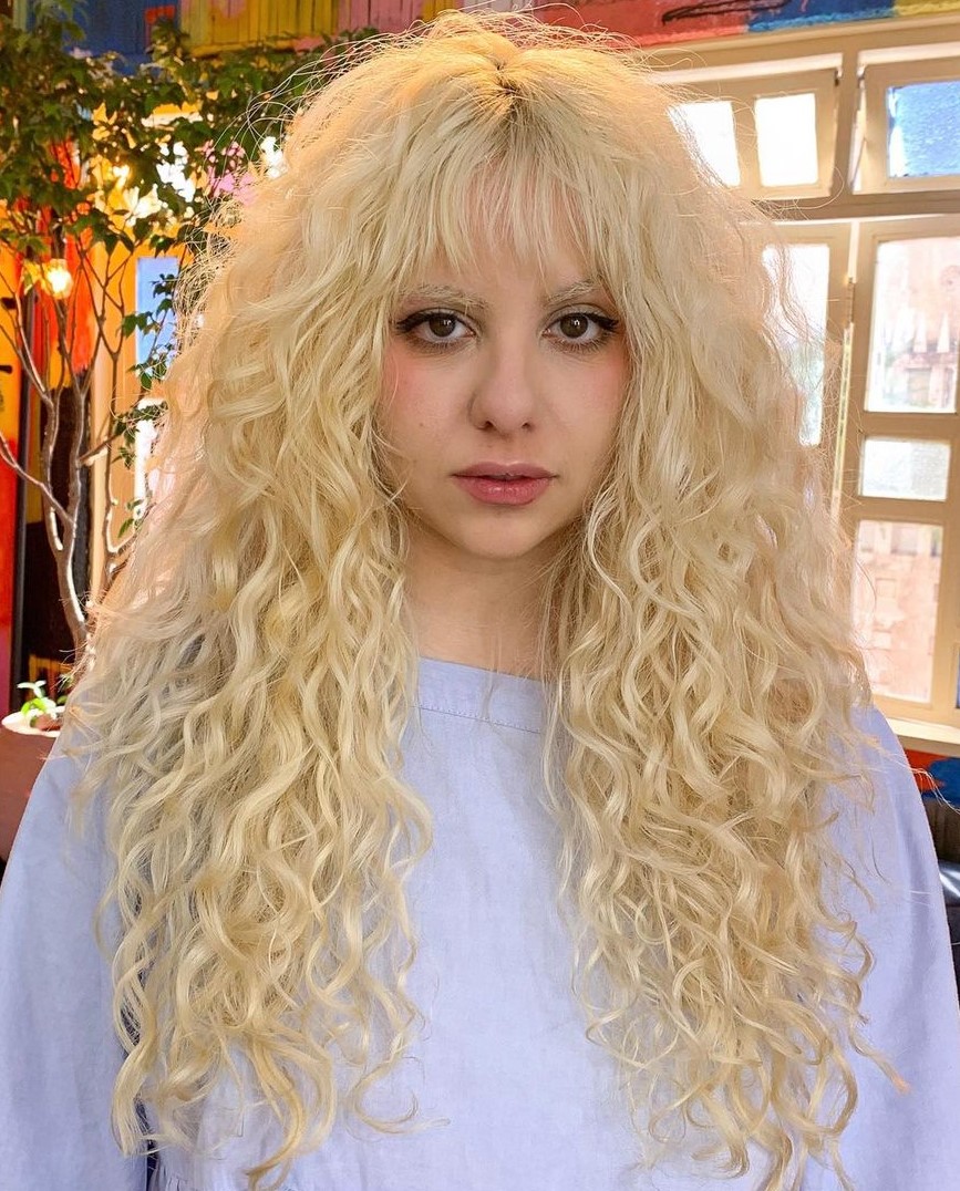 Long Light Blonde Hair with Shaggy Layers and Bangs
