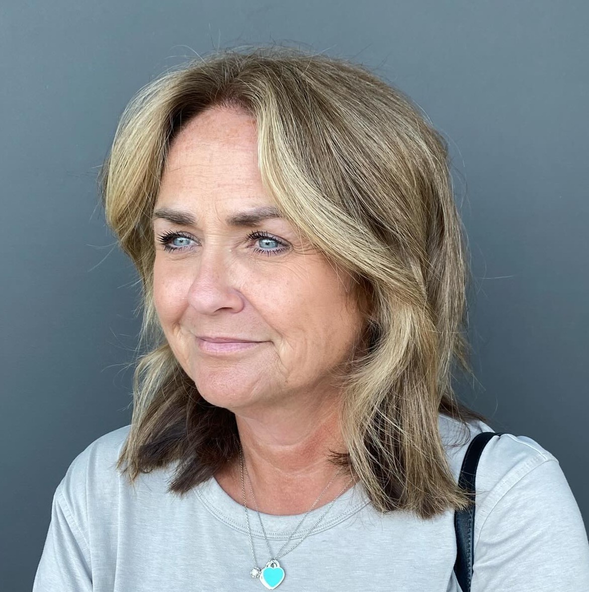 Over Face-Framing Medium Blunt Hairstyle