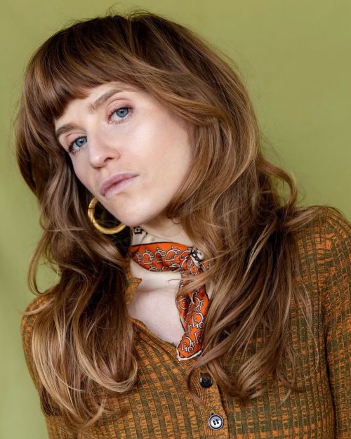 Curly Wolf Cut with Blunt Bangs Delightful Light Brown Wolf Cur with Bangs