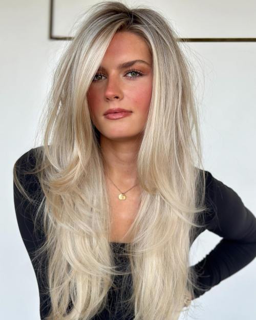 Long Wispy Rooted Creamy Blonde Hairstyle
