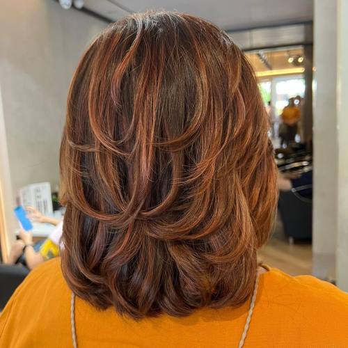 Mid Length Haircut with Piece y Layers