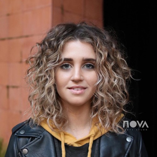 Centre-Parted Layered Curly Long Bob